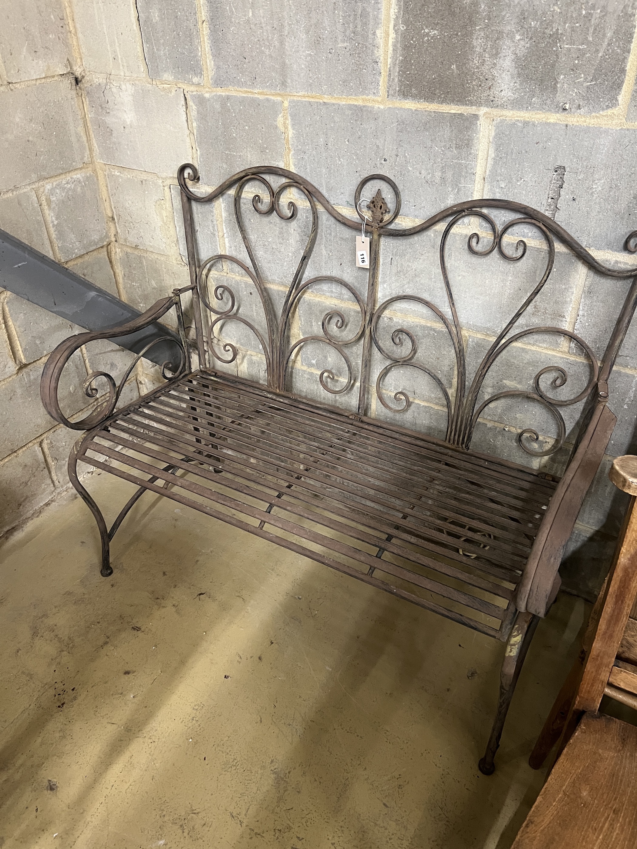 A painted wrought metal garden bench, length 117cm, depth 48cm, height 101cm